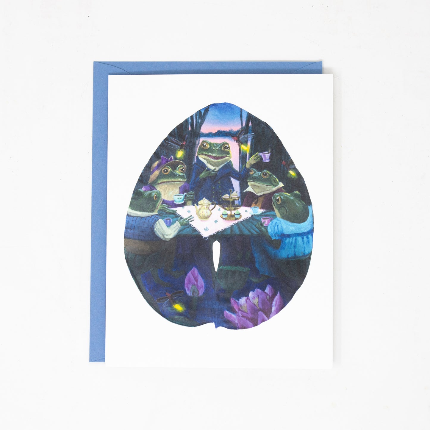 Greeting card with frogs at a table design on a white background