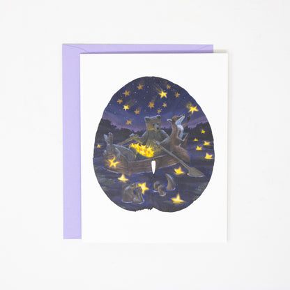 greeting card with a lavender envelope with a whimsical painting of a bear, rabbit, fox, and otter