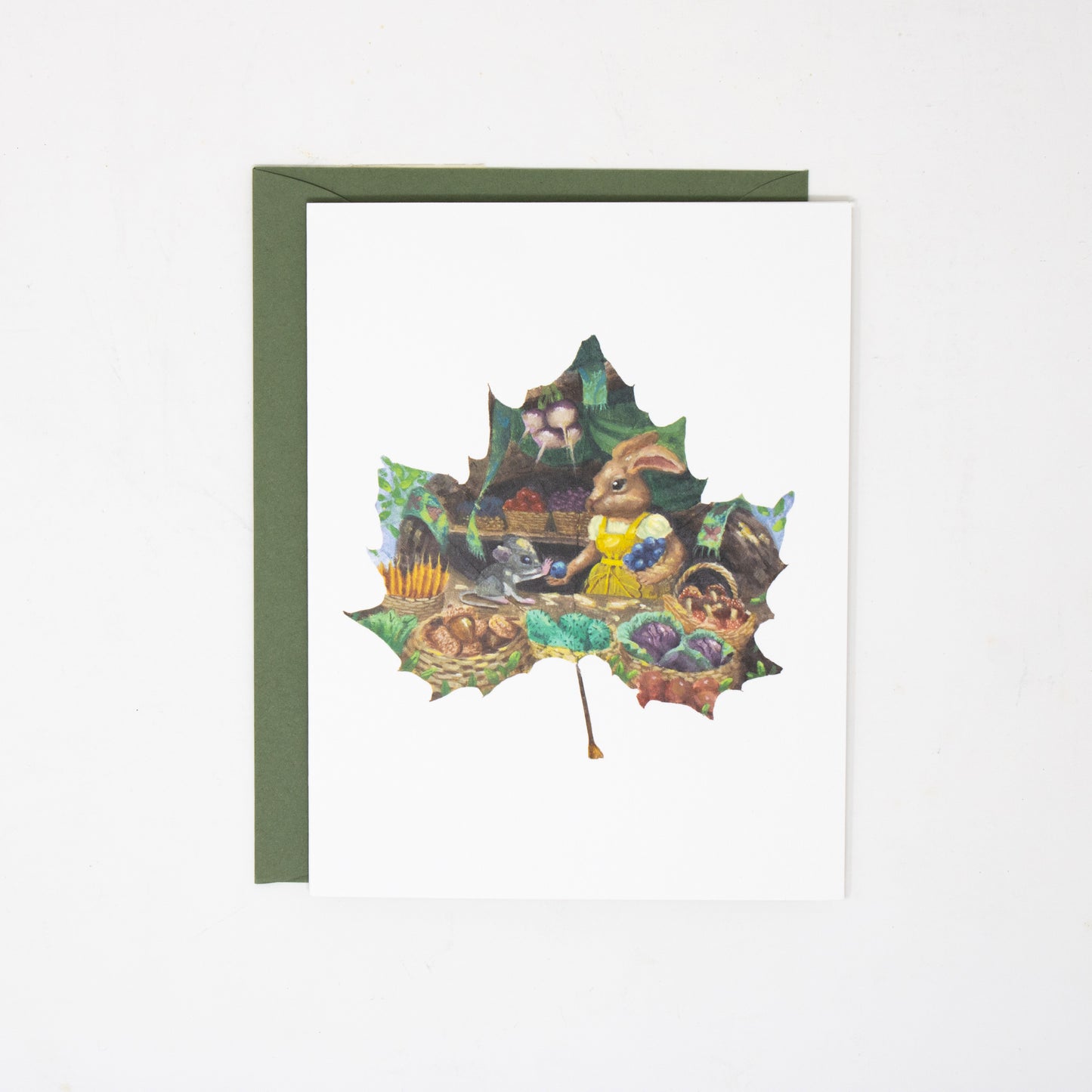 Greeting card with a leaf-shaped design featuring a rabbit on a white background.