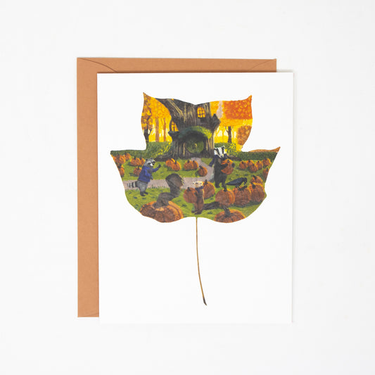 Greeting card with a colorful leaf design featuring animals on a white background
